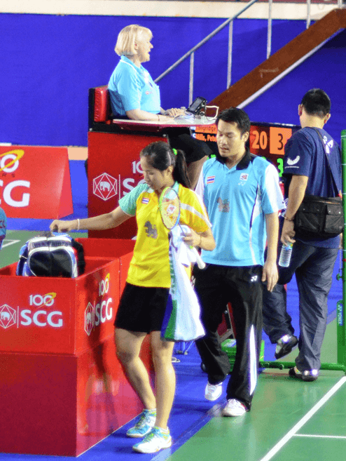 Ratchanok Intanon (left) grabs her bag after training as her coach Patapol Ngernsrisuk (right) looks on file photo.