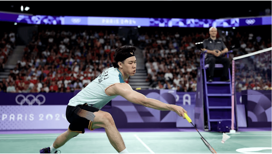 Arctic Open stunner: Lee Zii Jia (in white sleeveless shirt, returns a shot against Frenchman Christo Popov. Zii Jia defeated Popov.