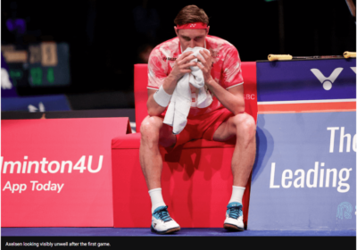 Denmark's VIktor Axelsen, in red uniform, sits helplessly in a lull during his match at the 2024 Denmark Open. Axelsen and Christie were ousted at 2024 Denmark Open