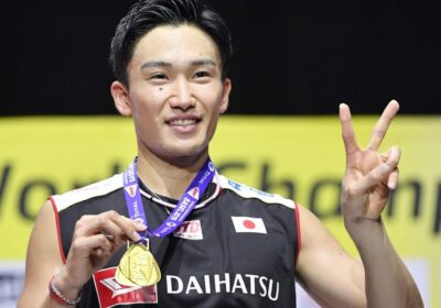 Japan's Kento Momota poses with his gold medal at a recent competition. Momota to call it quits for good in February, according to sources