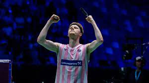 Anders Antonsen raised his hands in celebration after winning the French Open 2025 badminton title.
